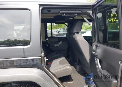 2016 Jeep Wrangler Unlimited Black Bear z USA, uszkodzony, nr VIN 1C4BJWDG6GL191982